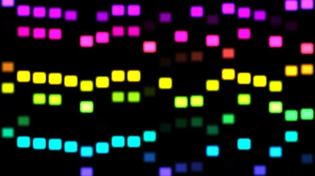 Colorful lights flash and move against a dark background