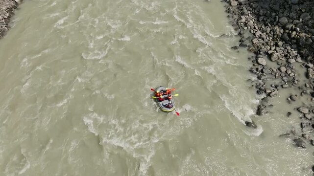 Outdoor adventure rafting on a mountain river in Tyrol Austria surrounded by alpine scenery featuring active recreation and sport tourism