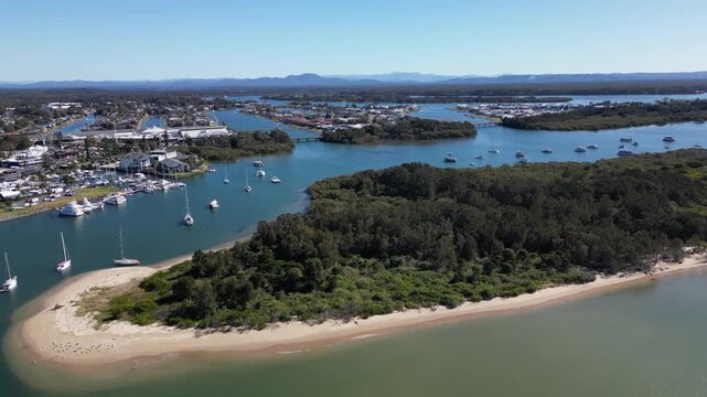 Drone panorama of Port Macquarie Australia showcasing tourist city views marina docks and vessels along the beautiful ocean shoreline