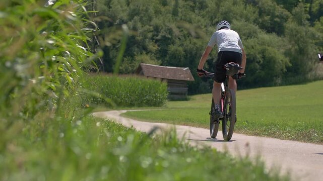 A man rides a bicycle for a walk in the mountains. Active sports recreation, cycling.