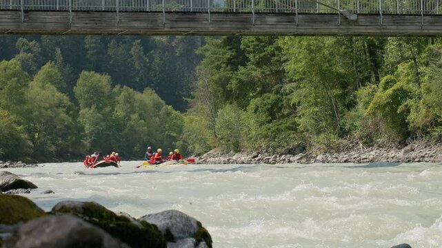 Rafting adventure on the mountain river in Otztal Tyrol Austria with inflatable boat navigating fast rapids among spectacular alpine landscapes