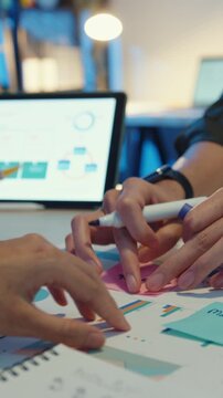 Vertical Screen : Close-up asia business people meeting plan analysis statistics brainstorm header of team hold tablet pointing graph chart and employee take note. Finance strategy statistics success.
