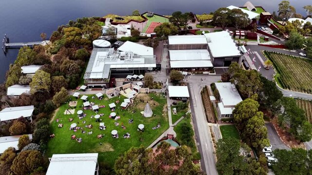 Public park and modern architecture of museum in Greater Hobart on Derwent river.