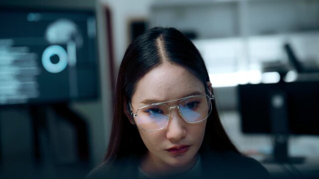 software developer wearing eyeglasses concentrating computer code modern office Ideal for software engineering, cybersecurity programming, digital technology information technology concepts.