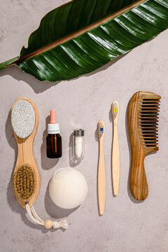 Collection of eco-friendly personal care objects flat laid against white background
