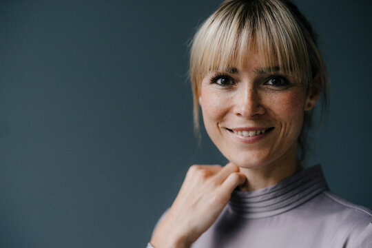 Portrait of a beautiful blond woman, smiling