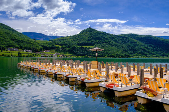 Italy, South Tyrol, Rental pedal boats on shore of Lake Kaltern