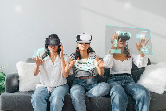 Friends using VR glasses gesturing at home