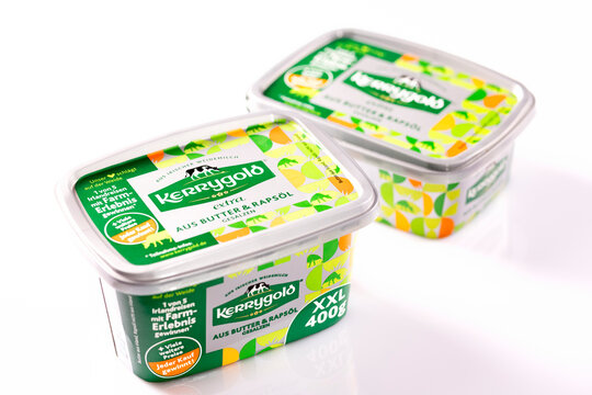 Kerrygold Extra butter and rapeseed oil spread tubs on white background &ndash; editorial food product image