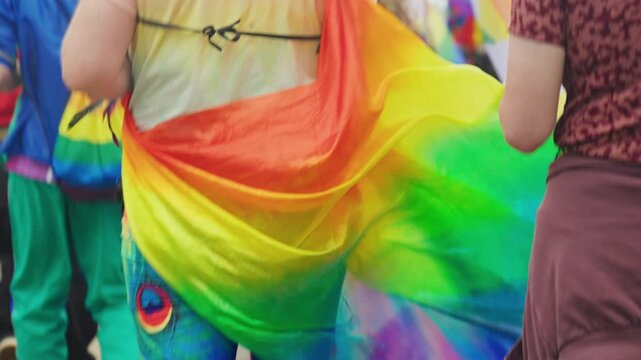 Flowing rainbow fabric at LGBTQ+ Pride parade in Warsaw