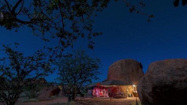 Time lapse of an adventurous overlanding safari trip in the middle of the african desert at night