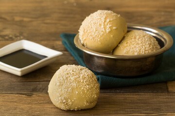 Fototapeta premium Fried Sesame Seed Balls with Soy Sauce Ramekin