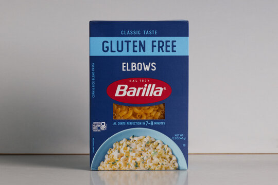 box of Barilla brand gluten free elbow macaroni pasta on a white background with copy space