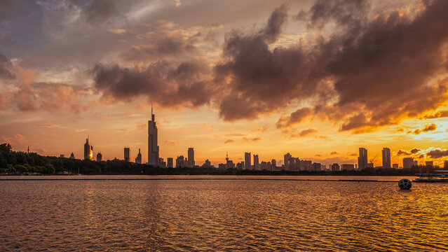 Nanjing city skyline with Zifeng Tower at sunset, Xuanwu Lake golden lake view dusk scenery