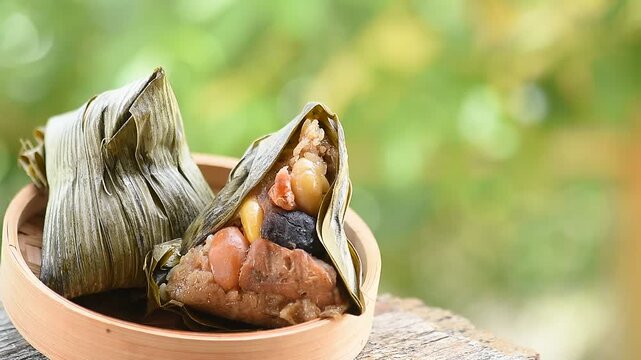 Zongzi or sticky rice dumplings placed on natural background.