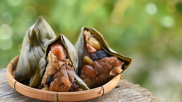 Zongzi or sticky rice dumplings placed on natural background.