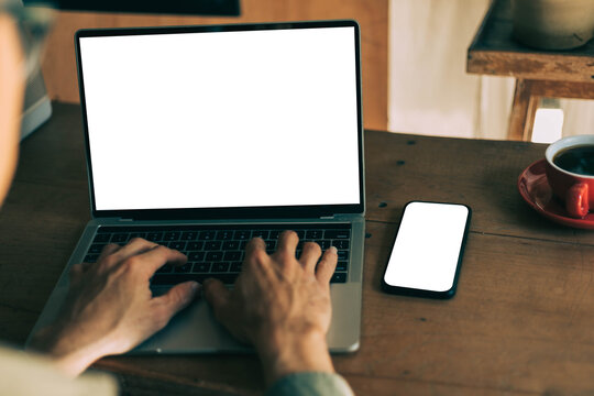 computer screen,mobile phone blank mockup.work using laptop texting cell phone.white background for advertising,contact business search information on desk.marketing,design