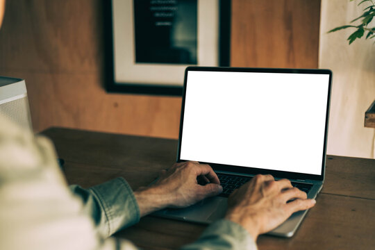 computer screen blank mockup.work using laptop with white background for advertising,contact business search information on desk at coffee shop.marketing and creative design
