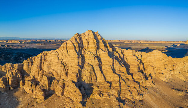 Aerial view of majestic yardang landforms in Gobi Desert at sunset, Dahai Dao, Xinjiang, China