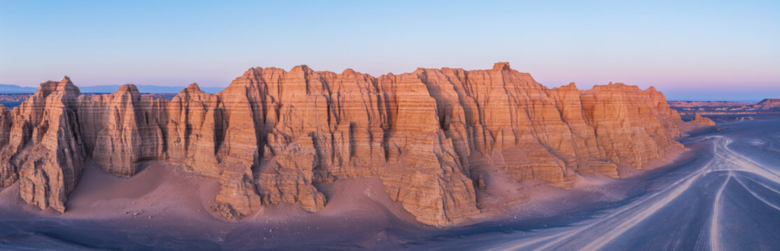 Aerial view of majestic yardang landforms in Gobi Desert at sunset, Dahai Dao, Xinjiang, China