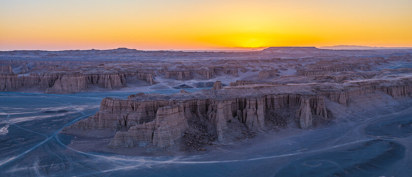 Aerial view of majestic yardang landforms in Gobi Desert at sunset, Dahai Dao, Xinjiang, China