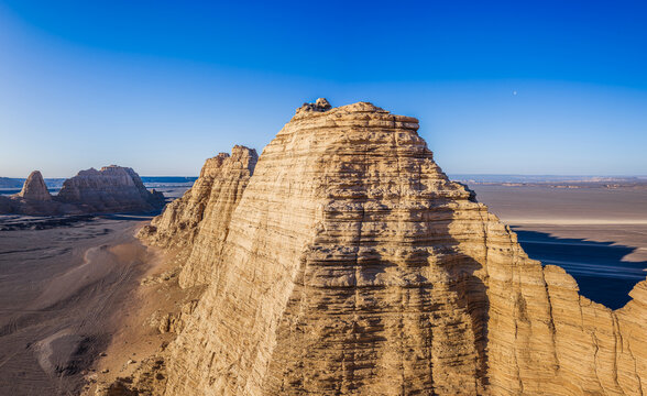 Aerial view of majestic yardang landforms in Gobi Desert at sunset, Dahai Dao, Xinjiang, China