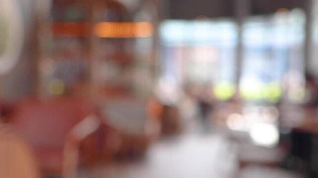 Abstract defocused blur of coffee shop interior with bokeh lights background