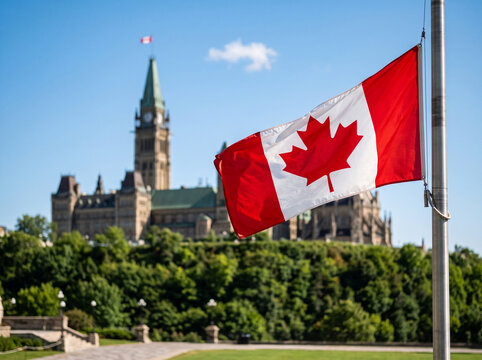 Canadian flag flying at halfmast in front of the parliament buildings in ottawa, ontario, canada