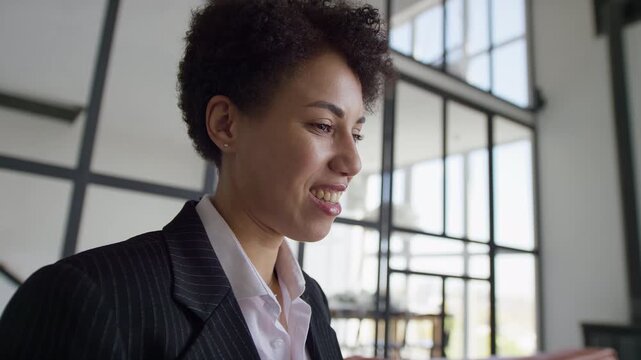 Smiling Businesswoman During Online Meeting in Office