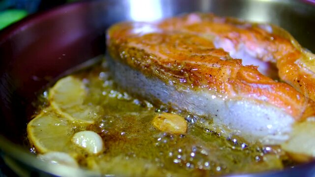 Step by step pan fried salmon steak recipe with fresh trout fillet seasoning oil and golden crust cooking process in black frying pan for homemade seafood meal
