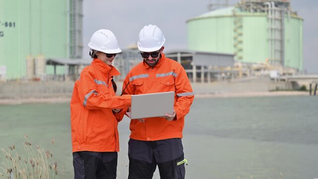 Oil and gas engineers collaborating at lng terminal