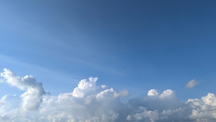 Fototapeta premium Bright Blue Sky With Fluffy White Clouds