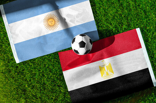 Argentina vs Egypt, Round of 16, national flags before international football match, football on green grass with stadium in the background