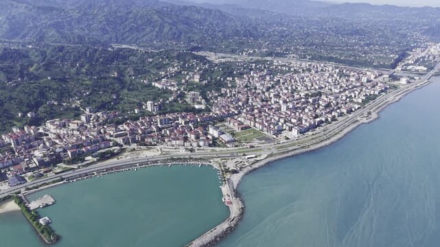 Aerial Drone Footage of Ardesen Town Center in Rize Turkey Featuring Black Sea Urban Landscape, Green Hills and Mountain Scenery
