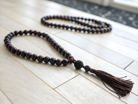 Dark brown wooden mala beads isolated on transparent background for mindful decor