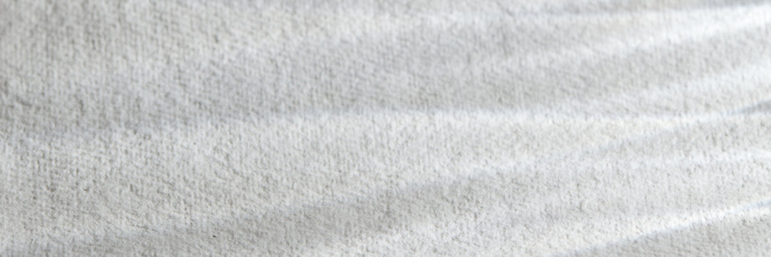 Handmade Paper Texture with Subtle Shadow Play and Natural Light
