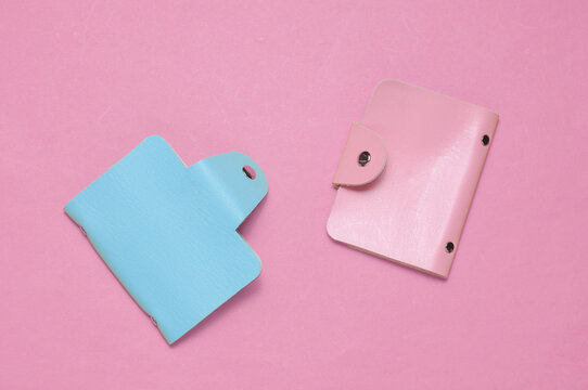 Blue and pink Leather wallets business card holders on pink background