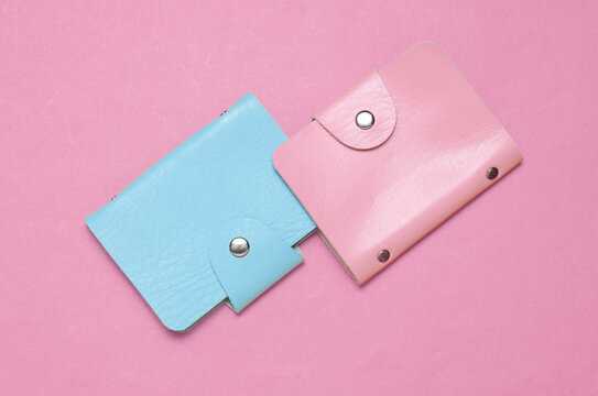 Blue and pink Leather wallets business card holders on pink background