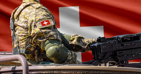 Switzerland flag with soldier at machinegun turret © lucky pics