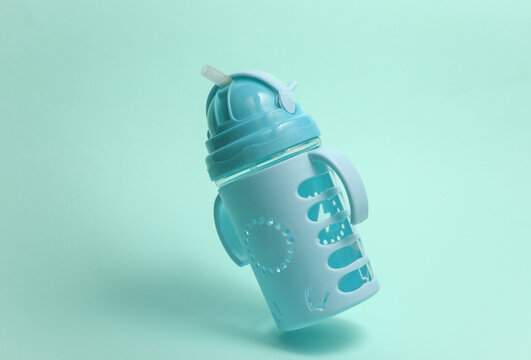 Drinking bowl for baby on a blue background.