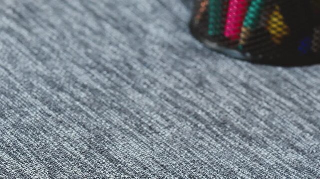 Collecting colorful scattered markers on a textured surface during an art session