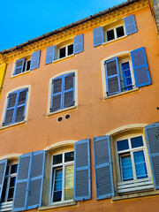 Fototapeta premium Mediterranean Building Facades with Colorful Shutters