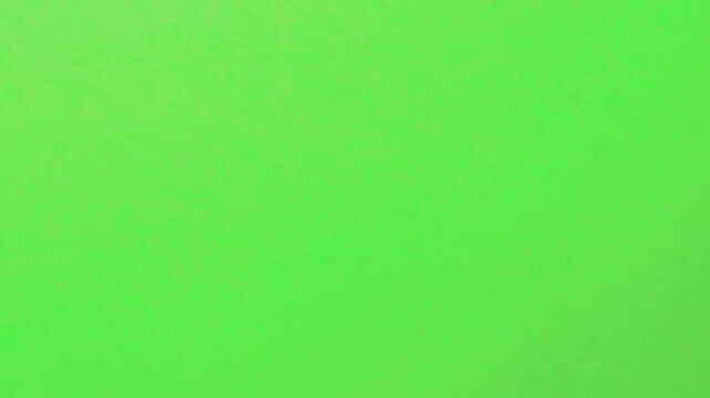 Drop a light bulb on green background for fun visual effects and experiments