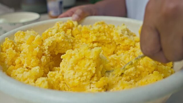 Hand Mixing Yellow Potato Dough for Traditional Peruvian Causa Lime&ntilde;a