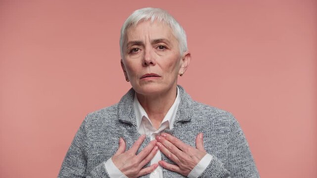 Senior Woman Experiencing Heartburn and Chest Discomfort