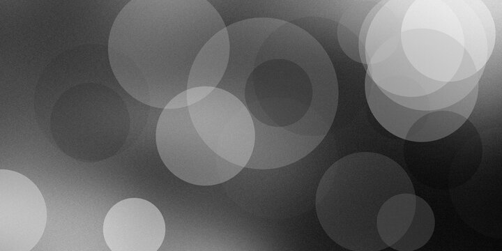 Abstract grayscale background with soft circular bokeh light spots and grainy texture for elegant minimal graphic design overlay.