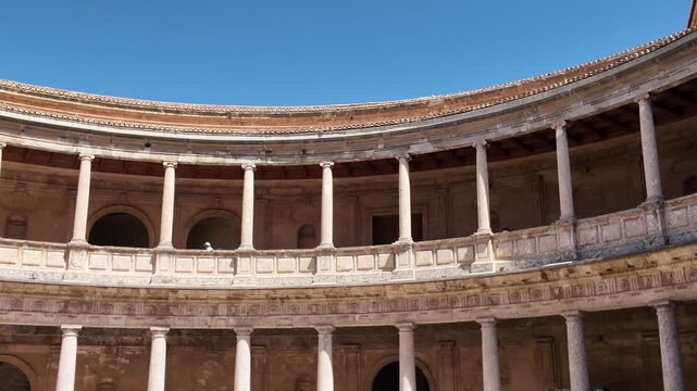 Panoramic view of the circular patio and cloisters of the Palace of Charles V, a Renaissance building in the Alhambra complex in Granada, Andalusia, Spain.