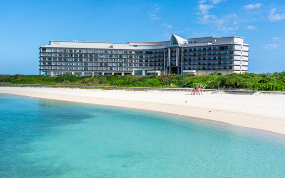 View of Miyako Sunset beach and Hilton Okinawa Miyako Island Resort building on beautiful day in Japan