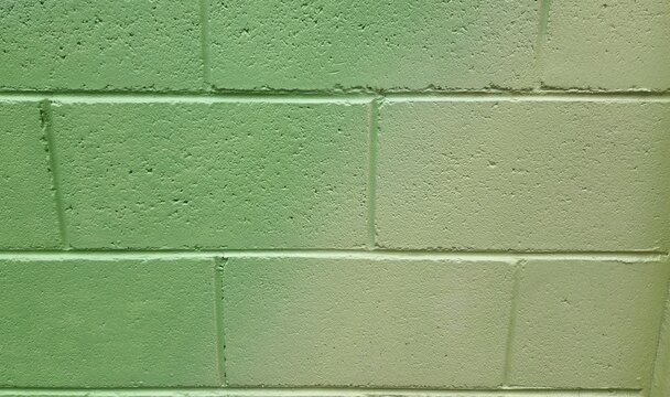 Light yellowish-green concrete block wall, yellowish-green paint, yellowish-green gradient paint, concrete block wall background, painted wall background