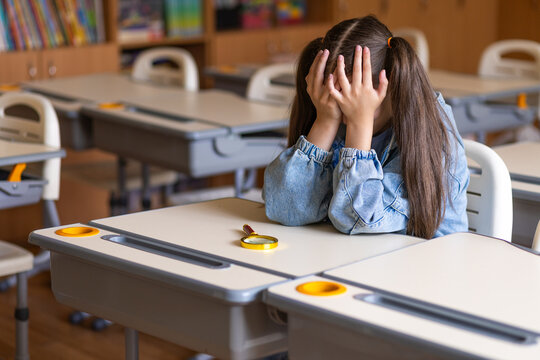 Excitement Meets Anxiety as Young Schoolgirl Prepares for the First Day of Lessons in Her Vibrant Classroom
